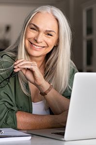 grey haired woman smiling